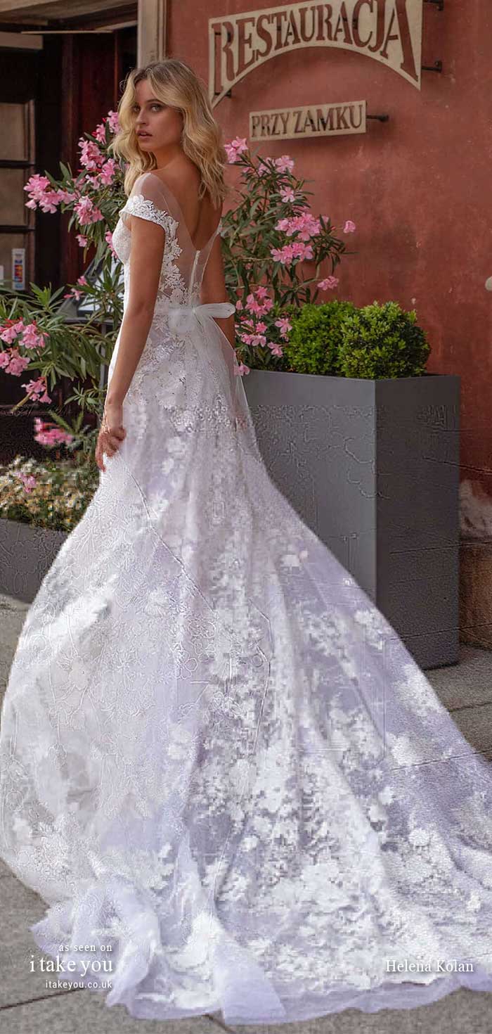 CIARA : Romantic A-line gown with a structured off shoulder bodice, made with a beautiful flowery lace and a big train  Featured wedding dress : Helena Kolan
