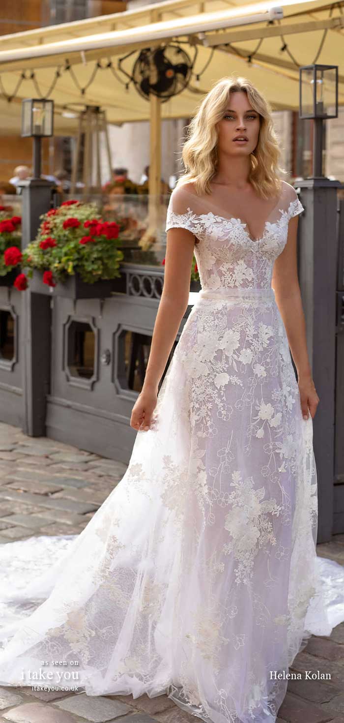 CIARA : Romantic A-line gown with a structured off shoulder bodice, made with a beautiful flowery lace and a big train  Featured wedding dress : Helena Kolan