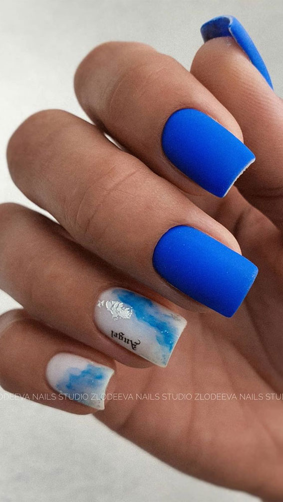 bright blue short nails, blue and white nail art designs, two tone nails, two color nail polish trend, 2 different color nails on each hand, mismatched nails, two tone nail polish ideas, nail designs, nail designs 2020, two color nail ideas #twotonenails #naildesigns2020 #naildesigns