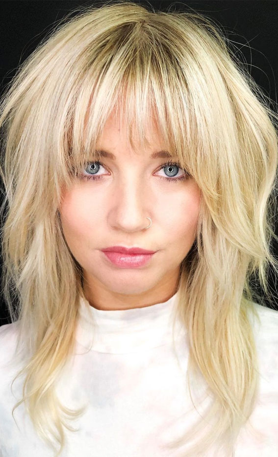 Image of Shaggy blonde half-up, half-down hairstyle