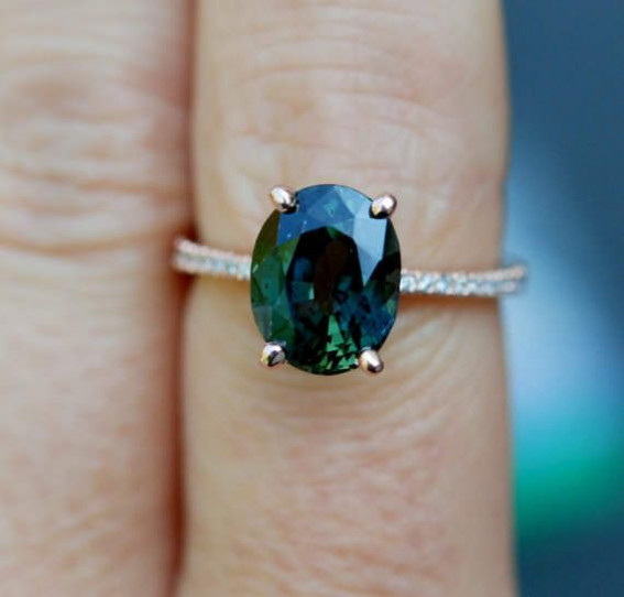 Utterly Beautiful Engagement Rings You’ll Want To Own : Green Gemstone Halo Ring