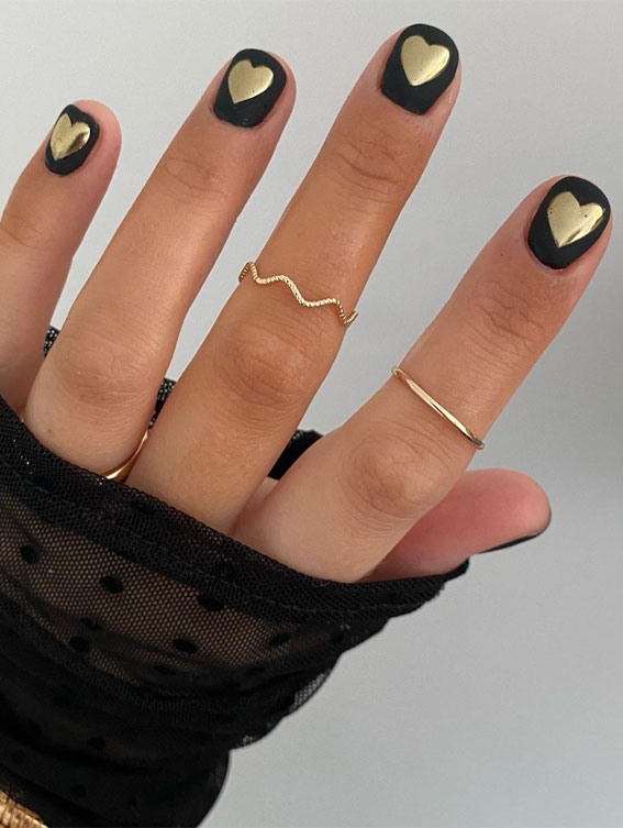 Stylish black nail art designs to keep your style on track : Gold Heart On Simple Black Nails