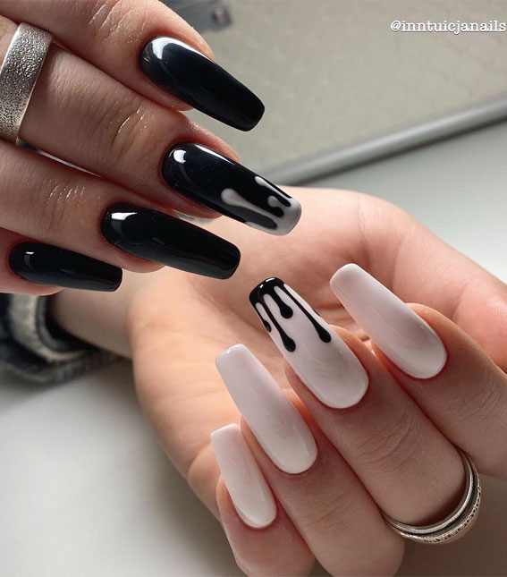 Stylish black nail art designs to keep your style on track : black dripped white nails