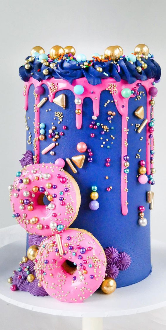 dripped pink icing on blue cake, navy and blue birthday cake, donut birthday cake, colorful birthday cake , girl birthday cake #birthday #bluecake #cake #birthdaycake