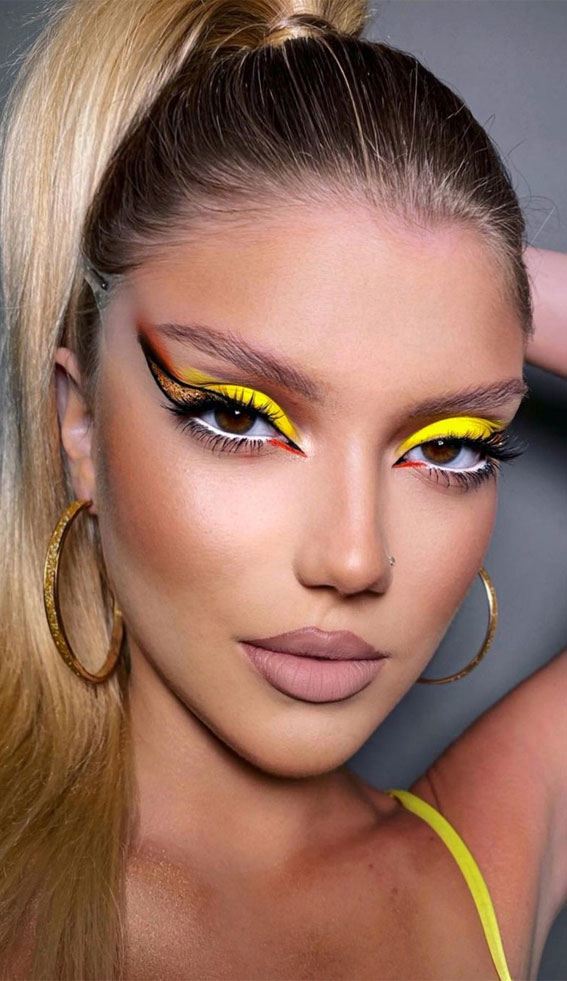 34 Creative Eyeshadow Looks That’re Wearable : Yellow Neon Eyeshadow & Graphic Liner