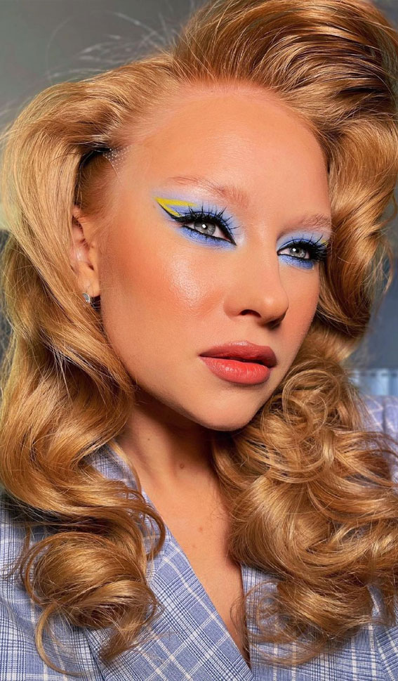 34 Creative Eyeshadow Looks That’re Wearable : Blue Eyeshadow with Yellow Neon Graphic Liner