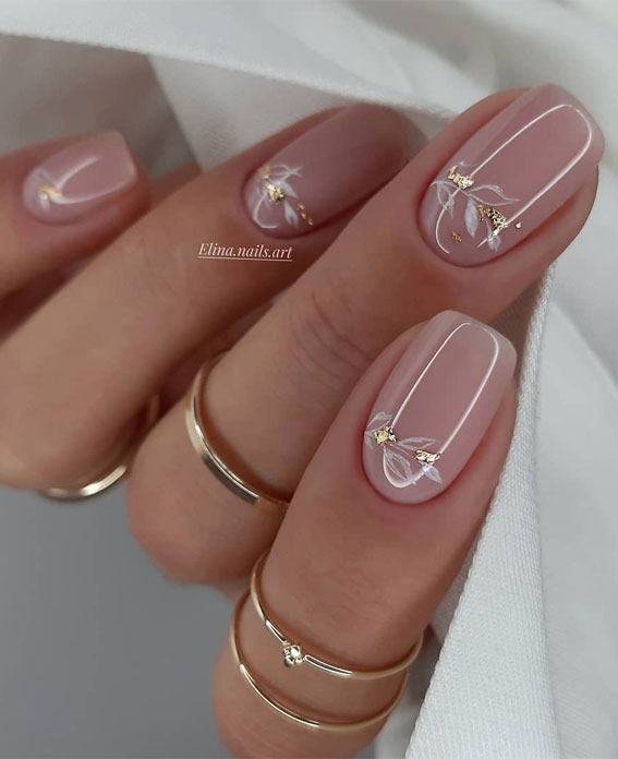 27 Charming Winter Nail Designs : White Floral Clear Nails with Gold Foil Details