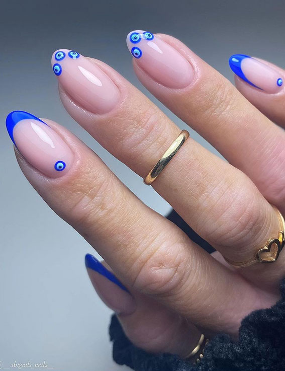 evil eye french tips, spring nails 2022, 2022 nail trends, acrylic nails 2022, french nail designs pictures, gel nails 2022, spring 2022 nail trends, french nails 2022, modern french manicure, french nail designs with color, colored French tip nails 2022