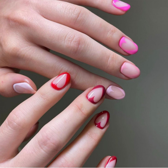 40 Best Valentine’s Day Nail Designs : Pink and Red Cutout Heart Nails