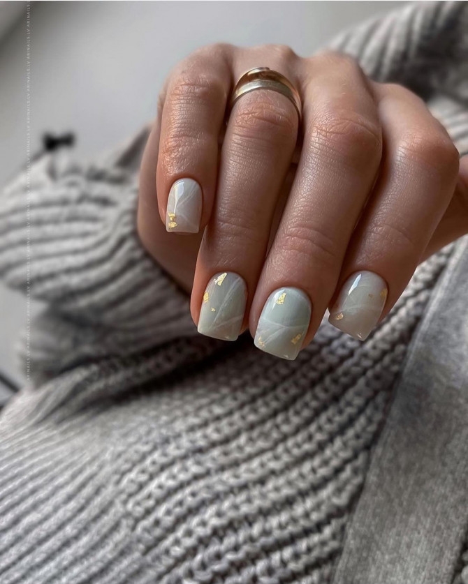 subtle spring nails, soft green marble nails