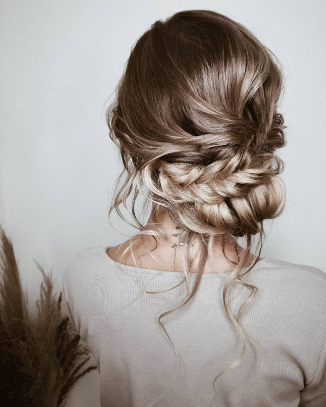 40 Beautiful Updo Hairstyles For 2022 : Boho Messy Braid Low Bun Hairstyle