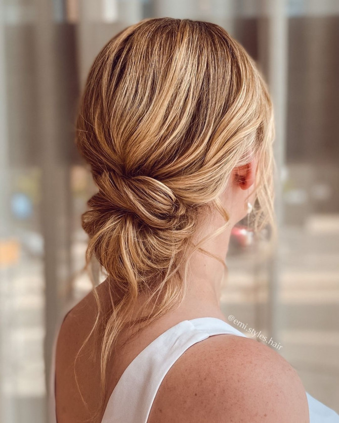 40 Beautiful Updo Hairstyles For 2022 : Effortless Blonde Messy Knot Low Bun