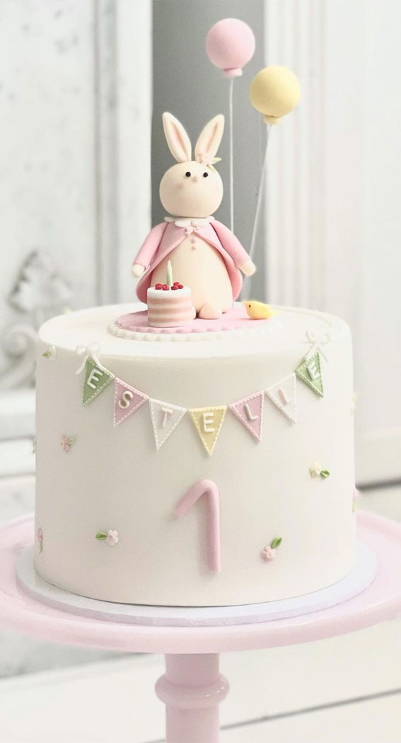 40 Cute First Birthday Cakes in 2022 : Cake Adorned with Bunting + Rabbit