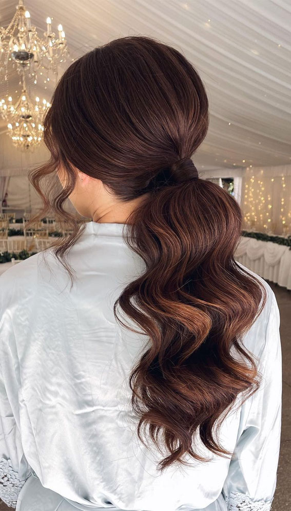 glam wavy ponytail, wavy ponytail, wedding hairstyles medium hair, wedding hairstyles, wedding hair down, wedding hairstyles for long hair, wedding hairstyles 2022, half up half down wedding hair, wedding ponytail, wedding hair updo, bridal hairstyles pictures