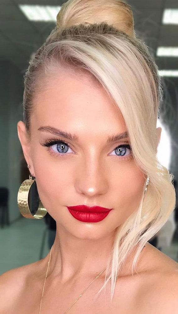 40+ Gorgeous Holiday Makeup Ideas : Blonde Top Knot with Red Lips