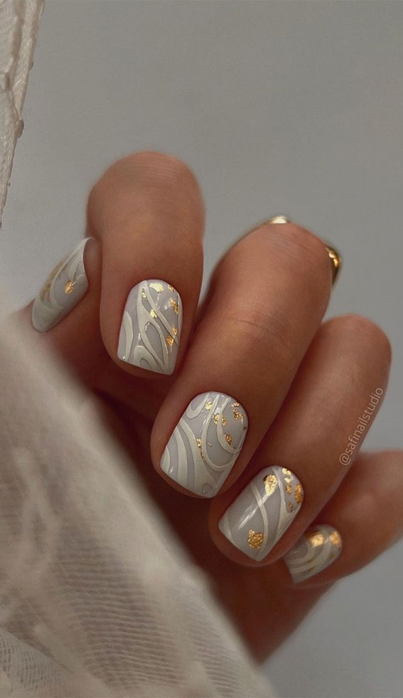 35 Nail Trends 2023 To Have on Your List : White Swirl Short Nails