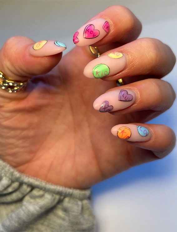 35 Best Valentine’s Day Nail Designs in 2023 : Colourful Heart Matte Nude Nails