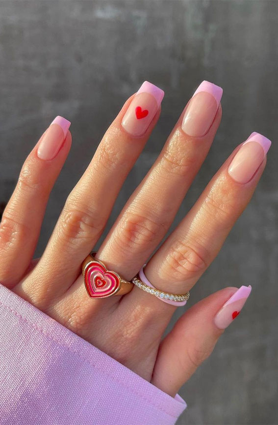35 Best Valentine’s Day Nail Designs in 2023 : Soft Pink Tips with Heart Details