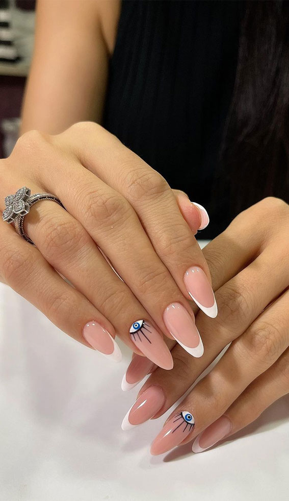 25 Beautiful Neutral Nails To Welcome 2023 : Evil Eye Nude Almond Nails