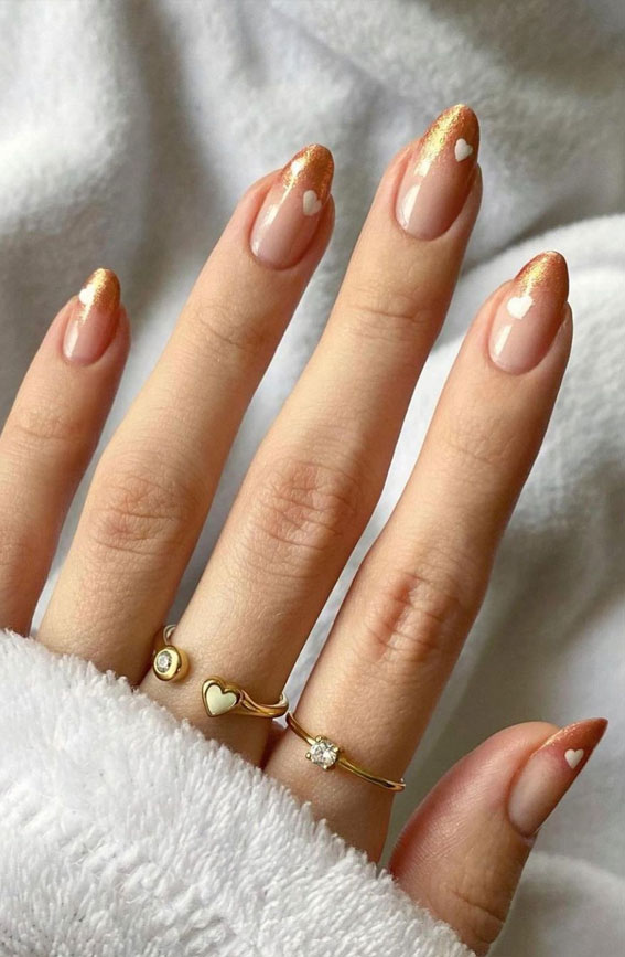 35 Best Valentine’s Day Nail Designs in 2023 : Ombre Glitter Gold Tips with Heart