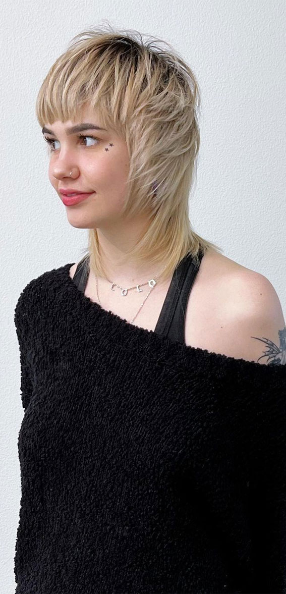 Shag Haircuts That’re Low-Maintenance Yet Stylish Haircut : Blonde Feathered Shag with Bangs