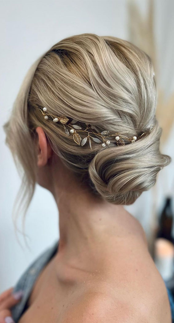 40 Updo Hairstyles Perfect For Any Occasion : Elegantly Classic Low Bun with Leaf Hair Vine
