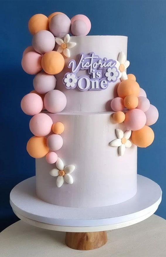 45 Cake Ideas to Remember for Baby’s First Milestone : Cascading Pastel Balls