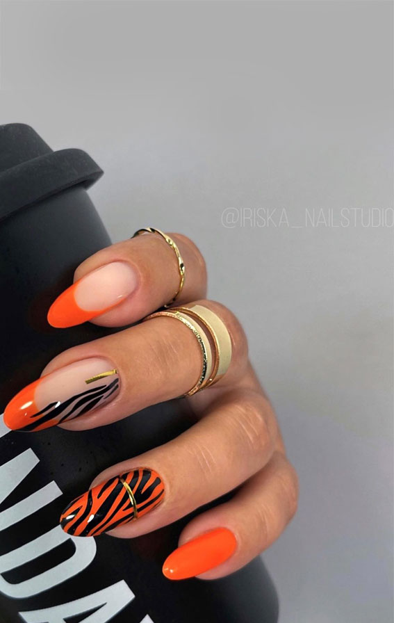 Indulge in the Classic Elegance of French Nails : Orange French + Animal Print Nails
