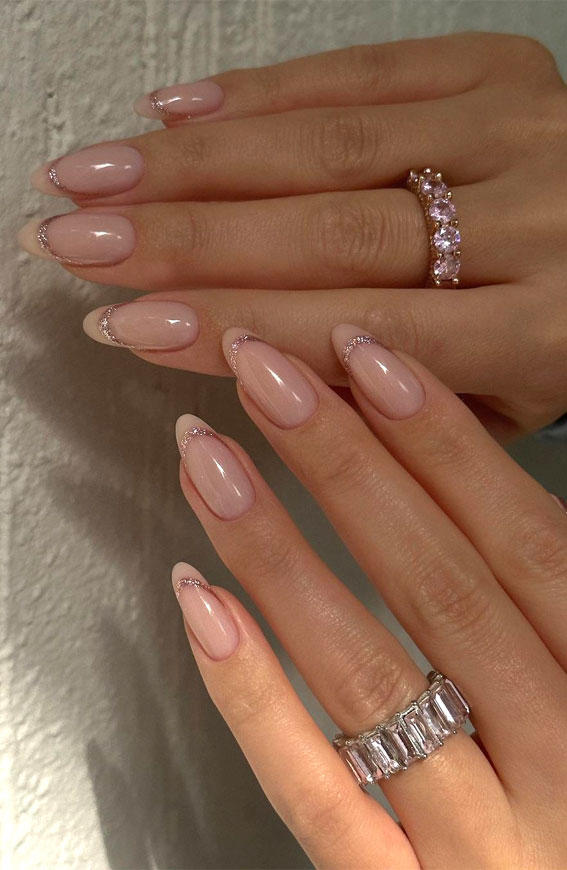Indulge in the Classic Elegance of French Nails : Nude Almond Nails with Sparkles