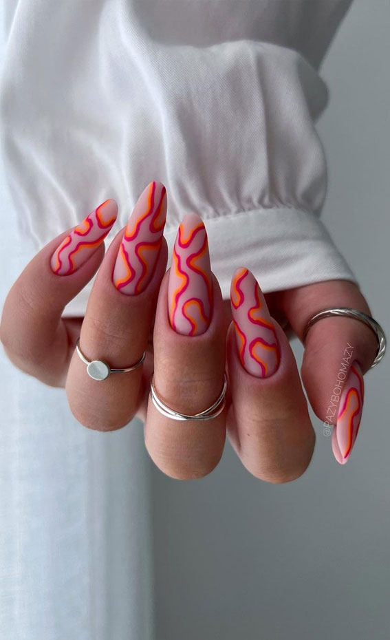 Embrace the Warmth with Radiant Summer Nails : Red & Orange Swirl Almond Nails