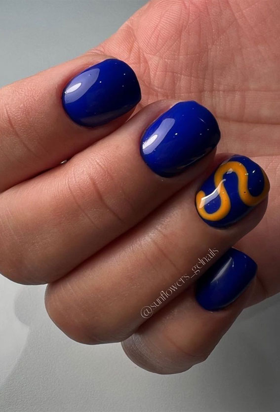 50 Rock Your Style with Trendy Nail Designs : Dark Blue & Orange Swirl Short Nails