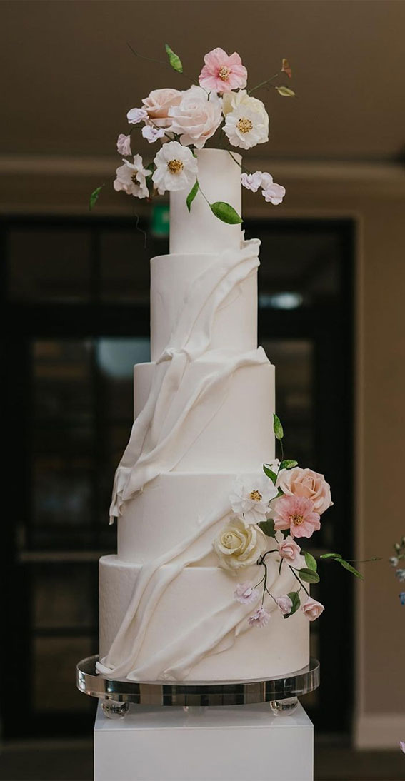 50 Romantic Wedding Cakes Love’s Sweet Symphony : 5 tiers with a drape detail and sugar flowers