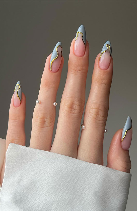 Embrace Autumn with Stunning Nail Art Ideas : Abstract Pale Green Nails with Gold Accent