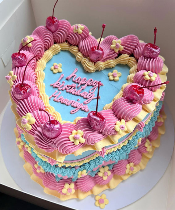 40 Delightful Lambeth Birthday Cake Ideas : Blue, Pink and Yellow Heart Shape Cake