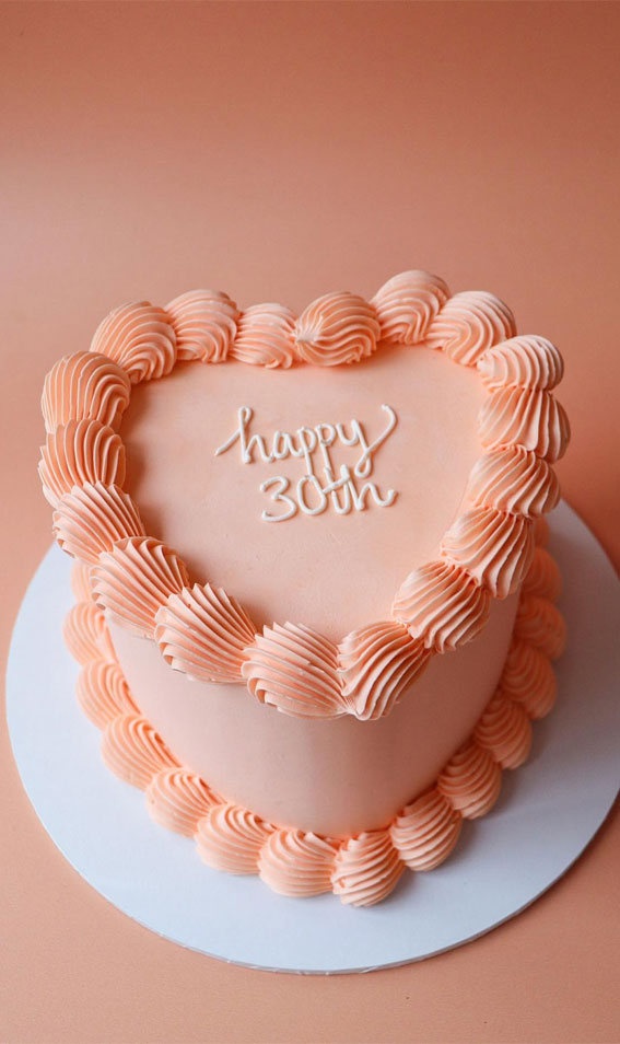 40 Delightful Lambeth Birthday Cake Ideas : Peach Colour Heart Shape Cake