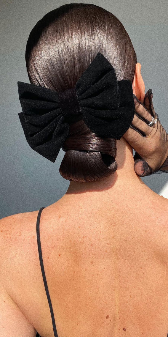 40 Timeless and Elegant Updo Hairstyles : Sleek Bun with Velvet Black Bow