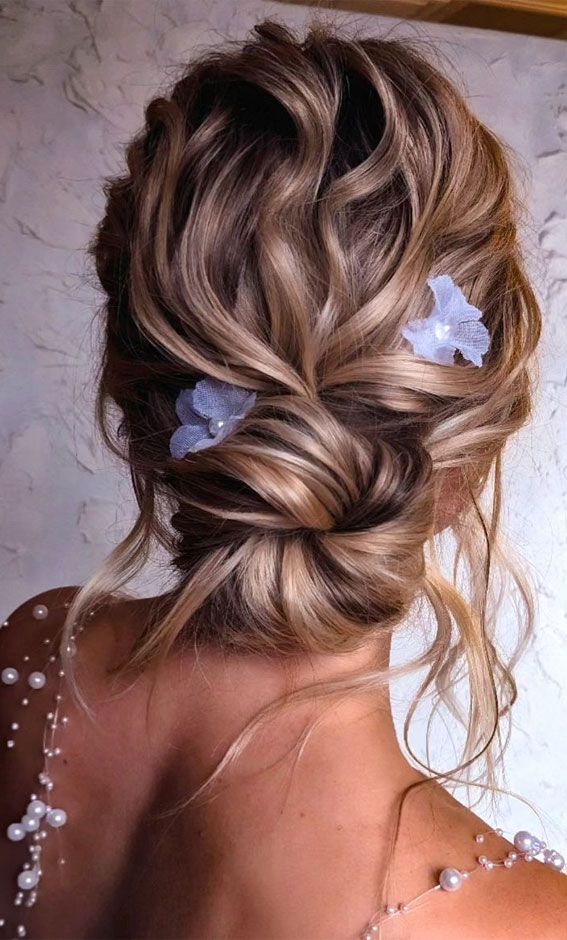 25 Stunning Hairdo Ideas for Every Special Occasion : Textured Chignon with Blue Flowers