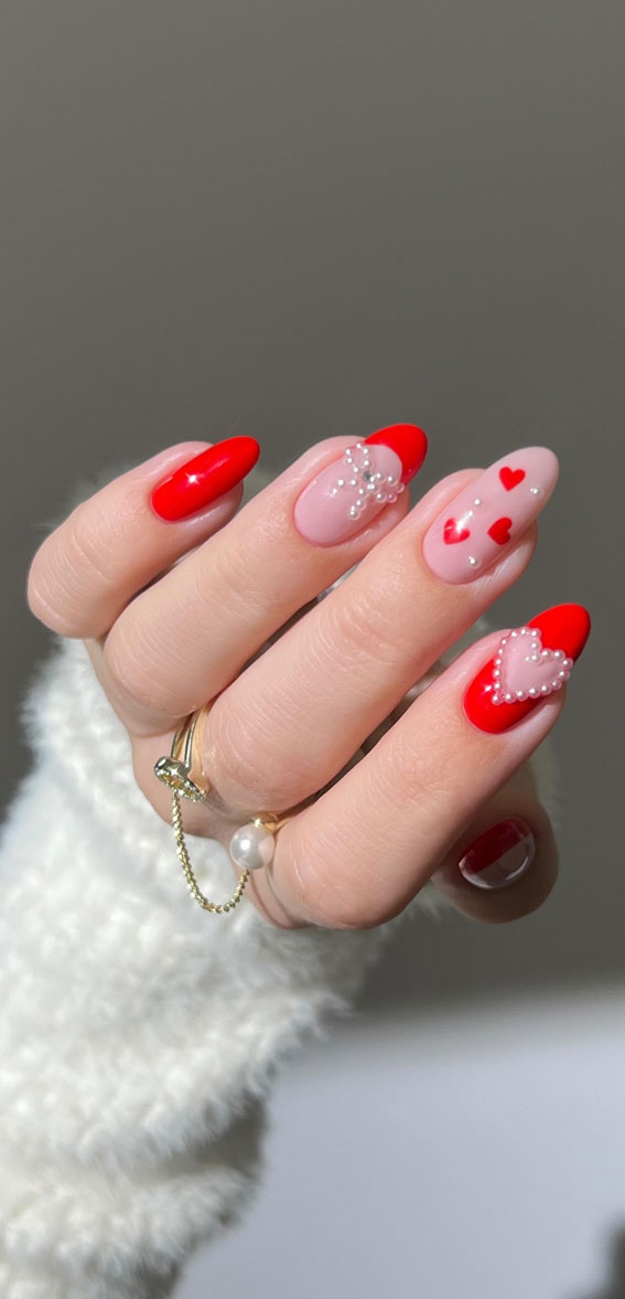 Captivating Valentine’s Day Nail Designs : Red Nails with Pearl Bow & Heart Aesthetics