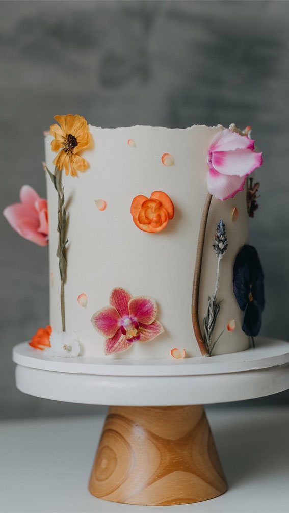 50 Birthday Cake Ideas for Every Celebration : Elegant White Cake with Edible Flower Accents