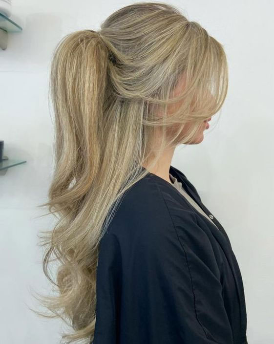 Prom Hairstyles for a Night to Remember : Voluminous Pony Half Up with Curtain Bangs