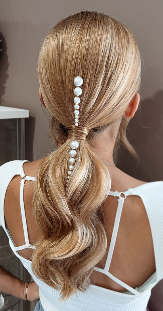 Unlock Your Style 30 Hairdos to Transform Your Look : Ponytail Bridal Hairstyle with Pearl Adorns