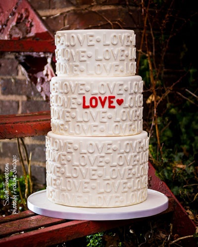white wedding cake , white wedding cake red letters