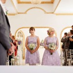 lilac bridesmaids walking down aisle