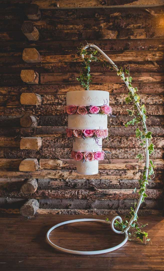 Four tier upside down sweet wedding cake with pink roses #weddingcake #upsidedown #cake #inspiration