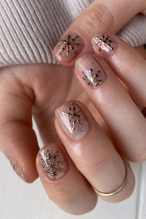 nude pink winter nails, pink nails with snowflake nails, winter nails, winter nails 2020