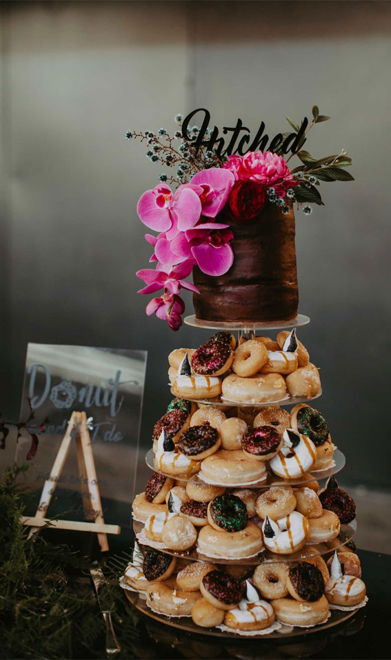 wedding cake and donuts, wedding cake topped with bright orchids