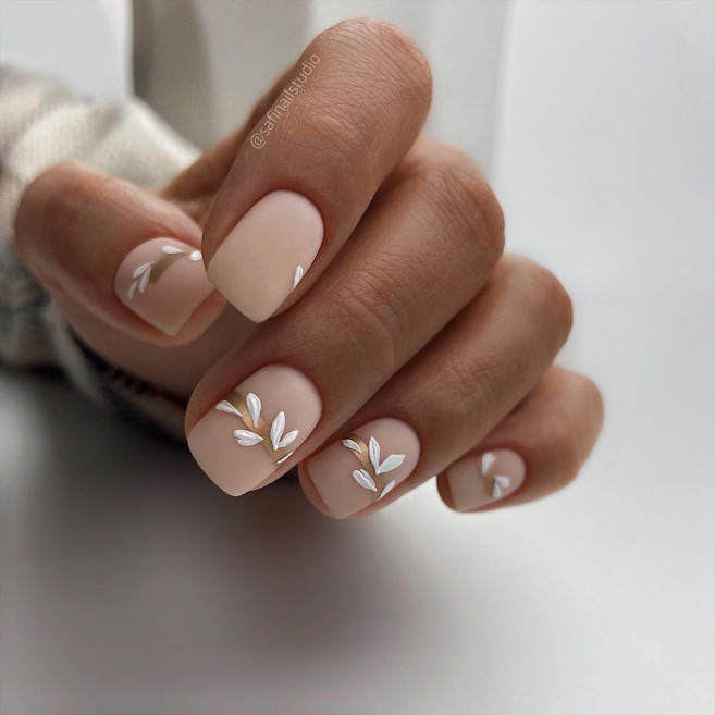 matte nude nails with white leaves, short nude nails 2022, spring nails 2022