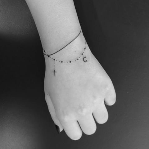 small tattoos on wrist, bracelet tattoos