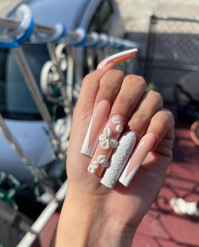 textured white nails, white french tips, acrylic nude nails with white, acrylic long nails with flowers, 3d flower nails