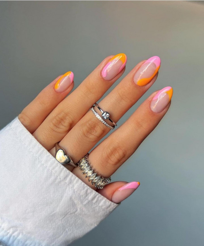50 Trendy Pink Nails That’re Perfect For Spring : Soft Pink and Orange Negative Space Nails